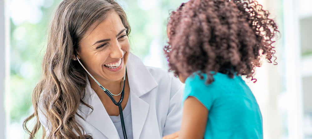 Pediatrician with little girl